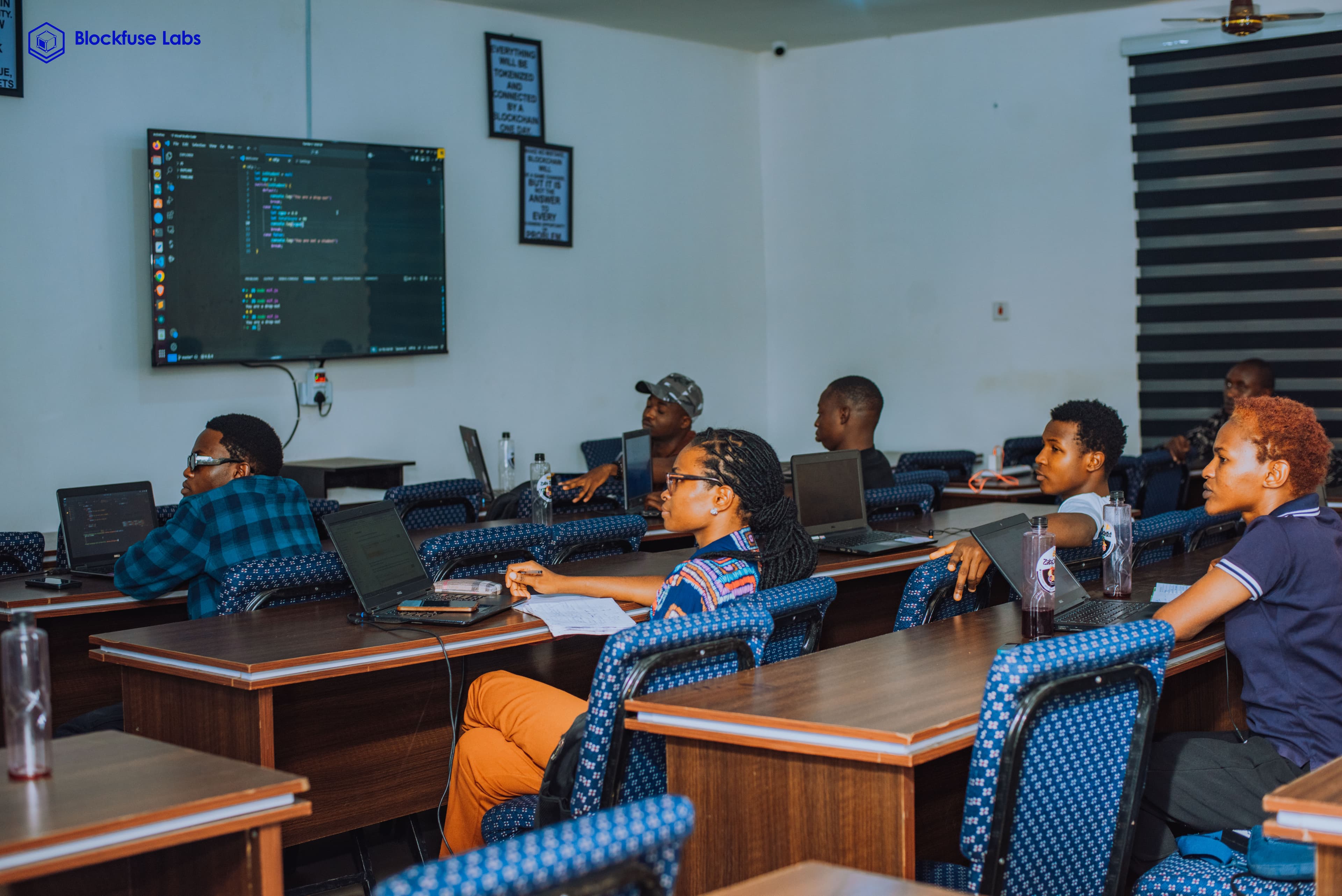 Blockfuse Labs engineers reviewing code together in the studio workspace