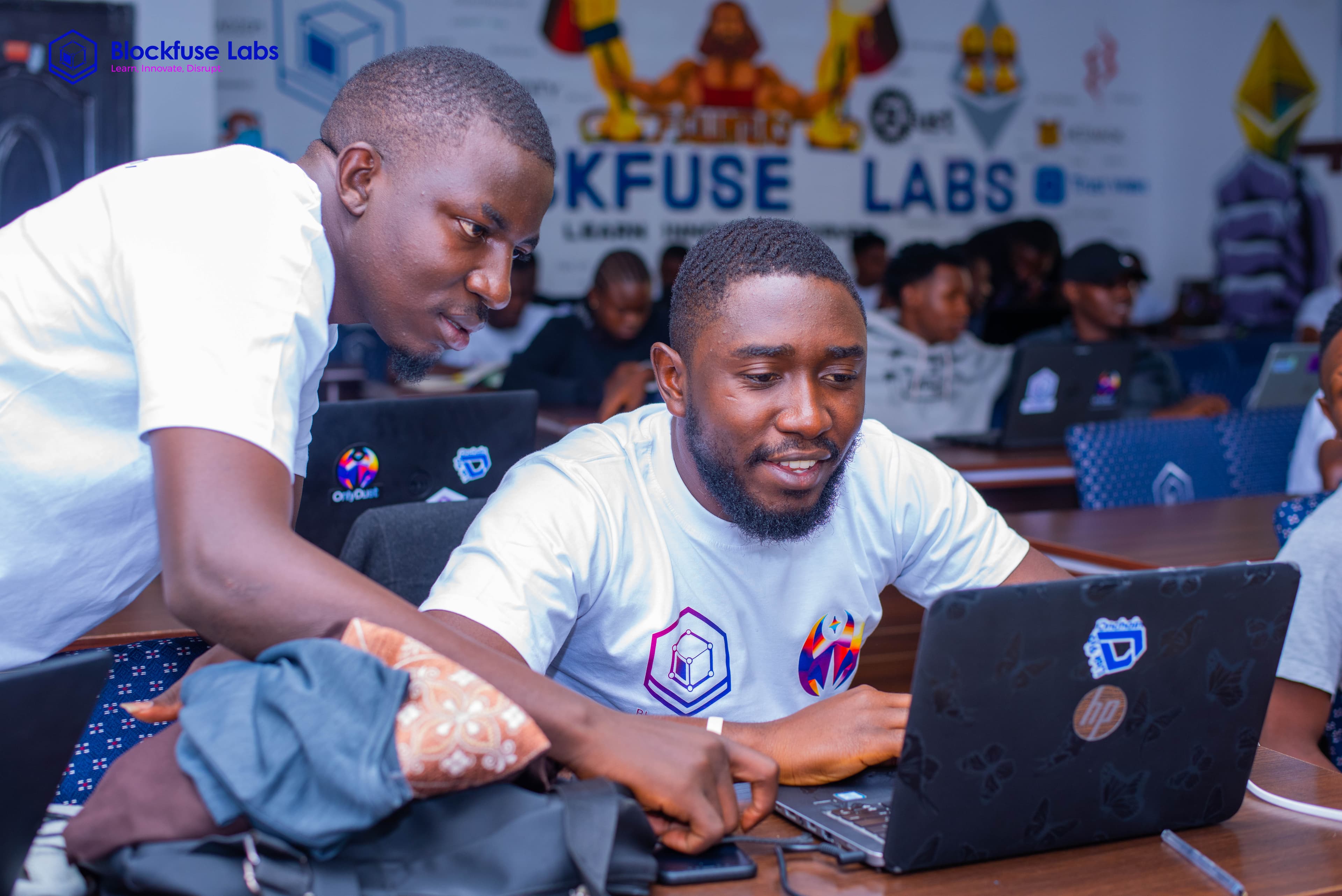 Two builders working together during a Blockfuse Labs event